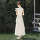 Silk Cypress Stand Collar Vestido 2025 Summer NUEVO TEMPERAMENTO DE Ropa para mujeres Bordado a la línea A-línea Irregular falda