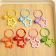 Colorful five-pointed star acrylic keychain pendant, dopamine color earphone case pendant, couple bag decoration, 1 color star keychain (random color)