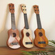 Kinderspielzeug können Ukulele-Spielzeug spielen Simulierte Gitarrenaufklärung Puzzle Musikinstrumente Musikspielzeug Log Farbe