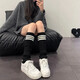Piles of striped knitted socks that won’t fall off, keep warm, show off slim legs, are versatile, mid-length, can be paired with snow boots, thick yoga pants, white
