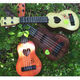 Xian Huaida can play children's simulated guitar children's ukulele sends string-pull music scores for beginners toy musical instruments gift [35CM] trumpet can play guitar - coffee color