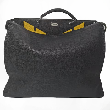 95新芬迪fendi黑色小怪兽恶魔黄眼睛斜挎手提包男包公文包配肩带