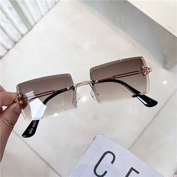 时尚超轻小精品太阳眼镜女欧美超火气质透明ins嘻哈切边无框墨镜茶色