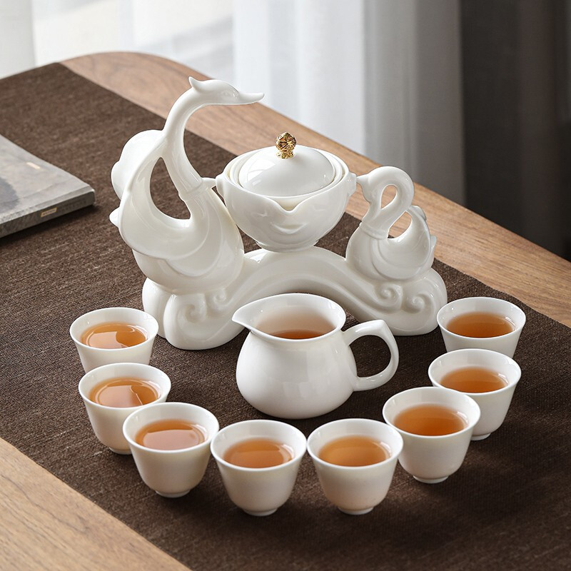Sushi ceramics lanolin jade lazy tea set set Chinese white Kung Fu automatic tea set Swan net red