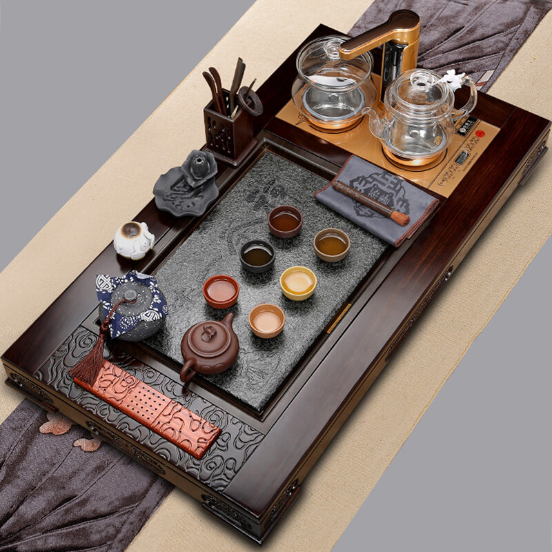 Gold inlaid jade kungfu tea set set sandalwood solid wood tea plate purple sand teapot teacup tea making stove complete set of yunxiangfu set in front of you