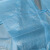 一次性加厚防护服参观防尘服反穿衣防水纹绣工作服淋膜民用 45g蓝色PP+PE覆膜橡筋袖口