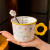 精东家 带刻度陶瓷牛奶杯家用儿童小花马克杯女生可爱早餐燕麦喝水咖啡杯 绿色早餐杯-350ml+花朵勺