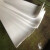 神斧建筑楼梯滑动支座0.5厚塑料片铁氟龙压条聚四氟乙烯垫板PTFE 加工 白色0.5mm*100mm*1米