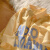 索宛亦（SUOWANYI）夏季新款设计感小众字母印花衬衫男女韩版慵懒风宽松休闲短袖衬 黄色 L
